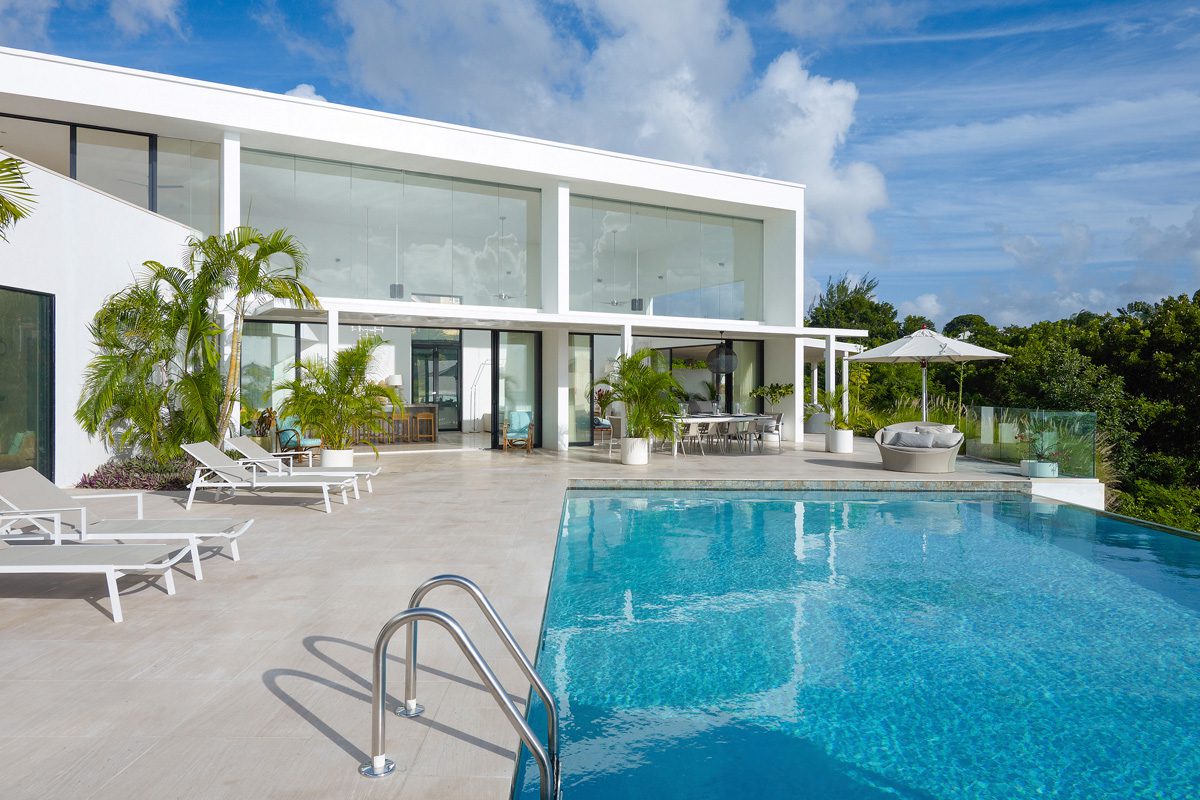 Atelier House pool with villa behind