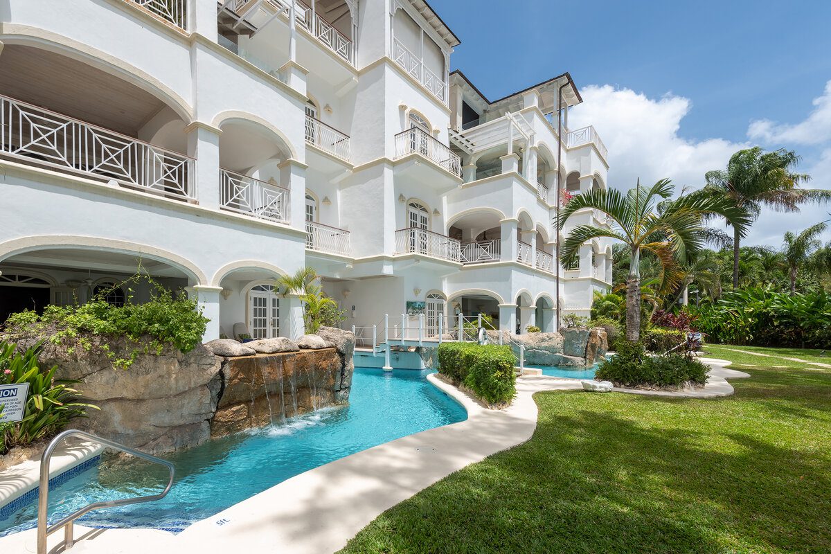 Pool view and exterior of at One Old Trees, a luxury beachfront condo in Barbados