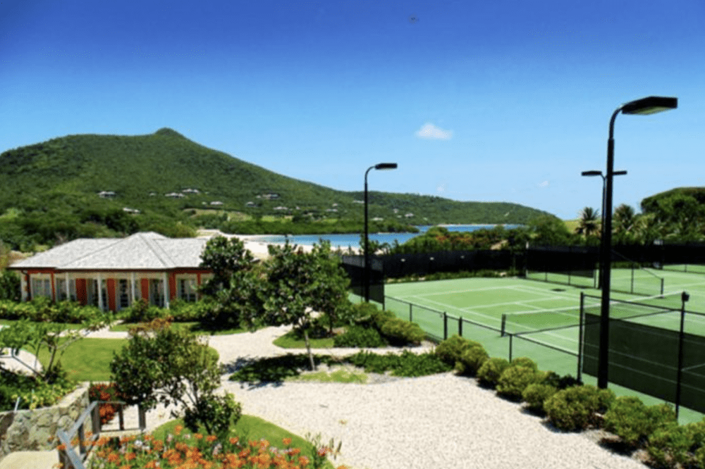 Guests enjoy tennis courts on Canouan island at our luxury villas in the Caribbeans.