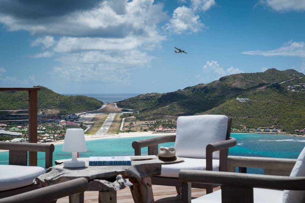 Luxury villa with amazing views of the runway for arriving and departing planes in St. Barth in the Caribbean, gorgeous spot for any honeymoon.