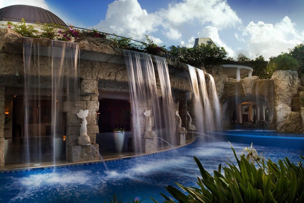 Gorgeous luxury villa perfect for honeymooners in Barbados in the Caribbean, complete with pool access and waterfall effects.